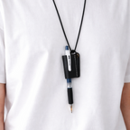 Person wearing a white shirt with a black leather strap for pen holder attached to a necklace.