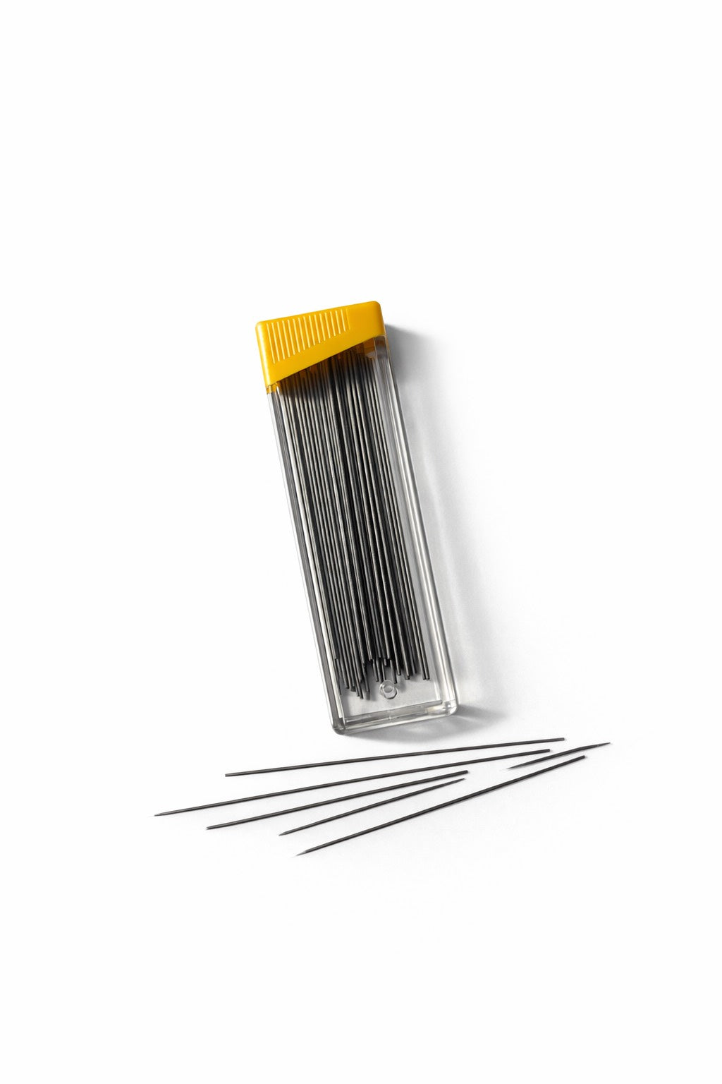 mechanical pen leads  with a yellow lid on a white background