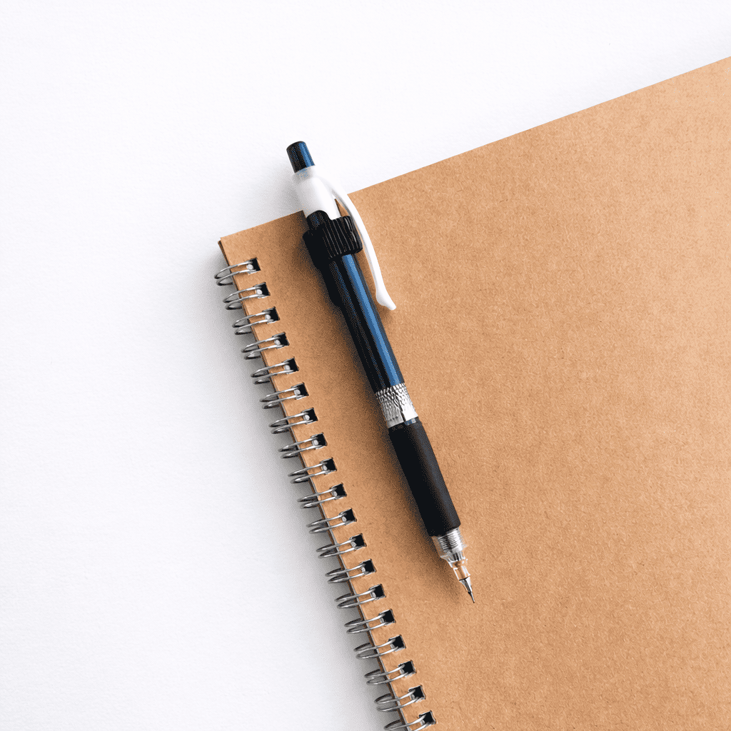 Notebook with pen holder on a white background