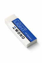 White eraser with blue label on a white background