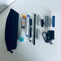 japanese everyday stationery items including pens, mechanical pen, sand erasers, knock type erasers, correction tape, pen holder, pen strap, leather cap for a pencil erasers on a white surface.