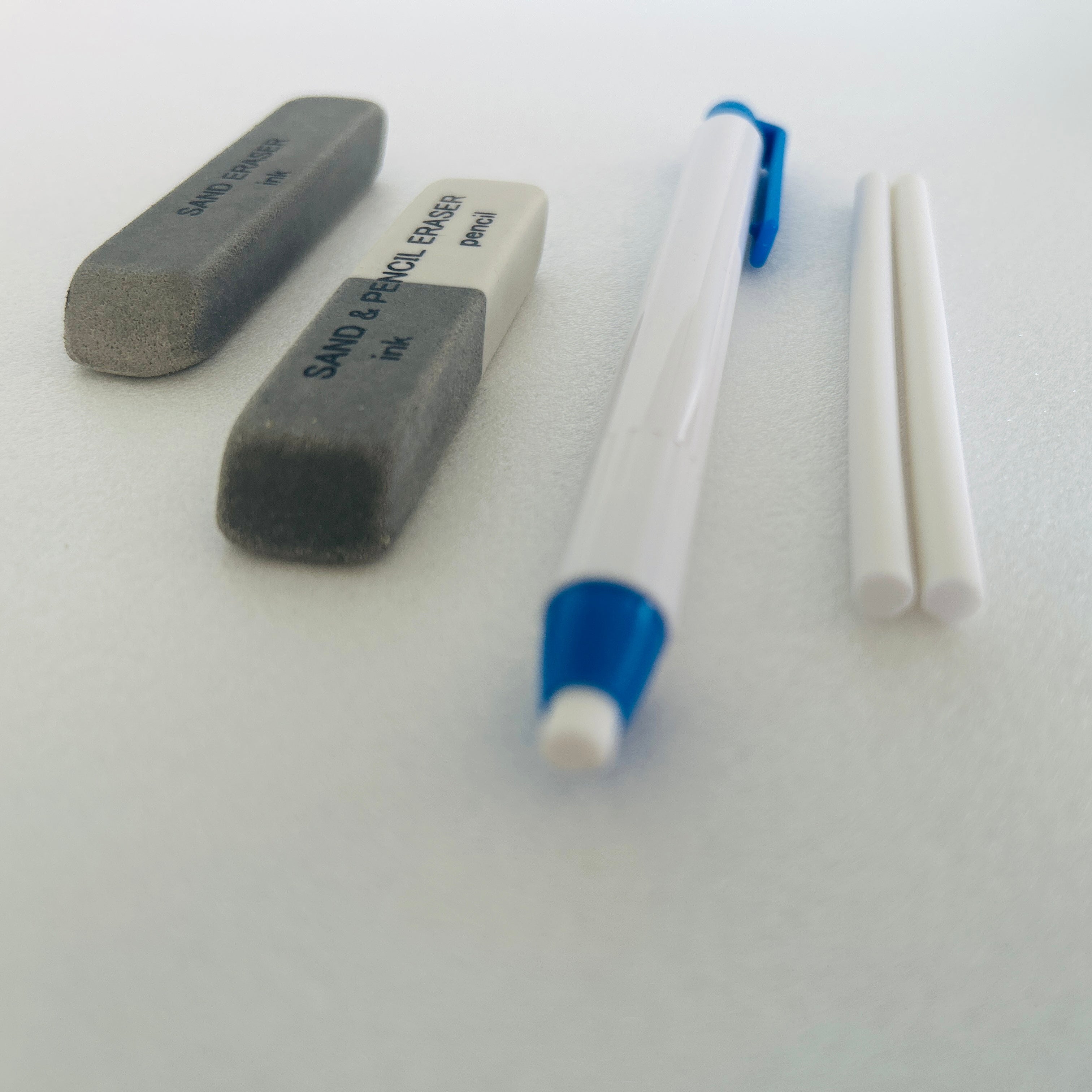two sand erasers and knock type erasers pen with two extra leads in kuroshi Japan